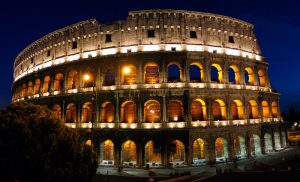 Rome, Italy's Colosseum at night. Built by Vespasian and dedicated in 80 AD, the Colosseum has been a symbol of Rome for 2 000 years. Gladiators fought animals and themselves, sometimes to the death, for over 300 years in this arena.